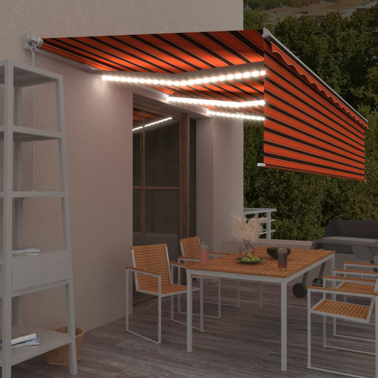 vidaXL Käsin sisäänkelattava markiisi verhot/LED 6x3 m oranssiruskea